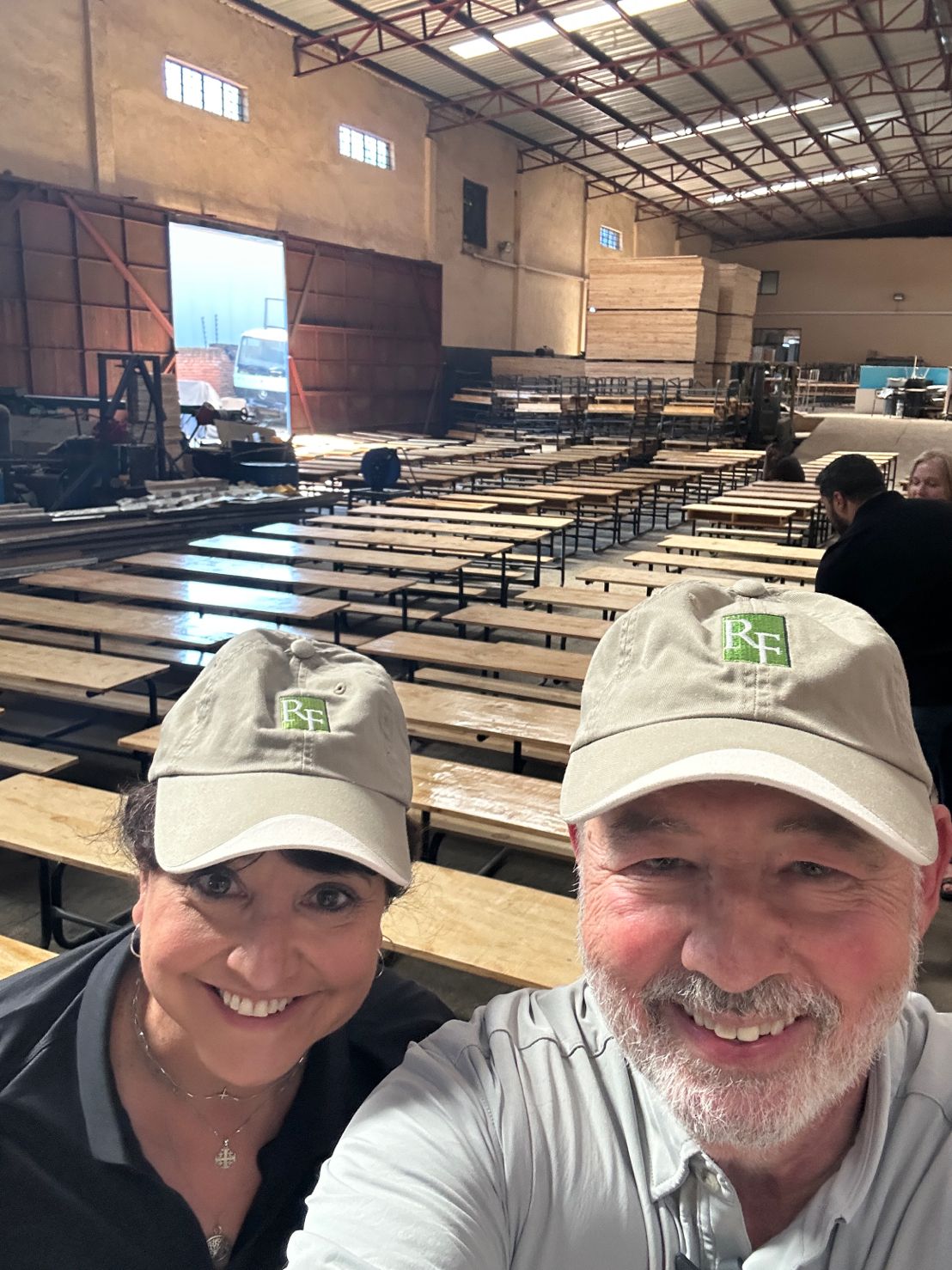 Sharon Crane and R. Danny Huntington in front of new desks