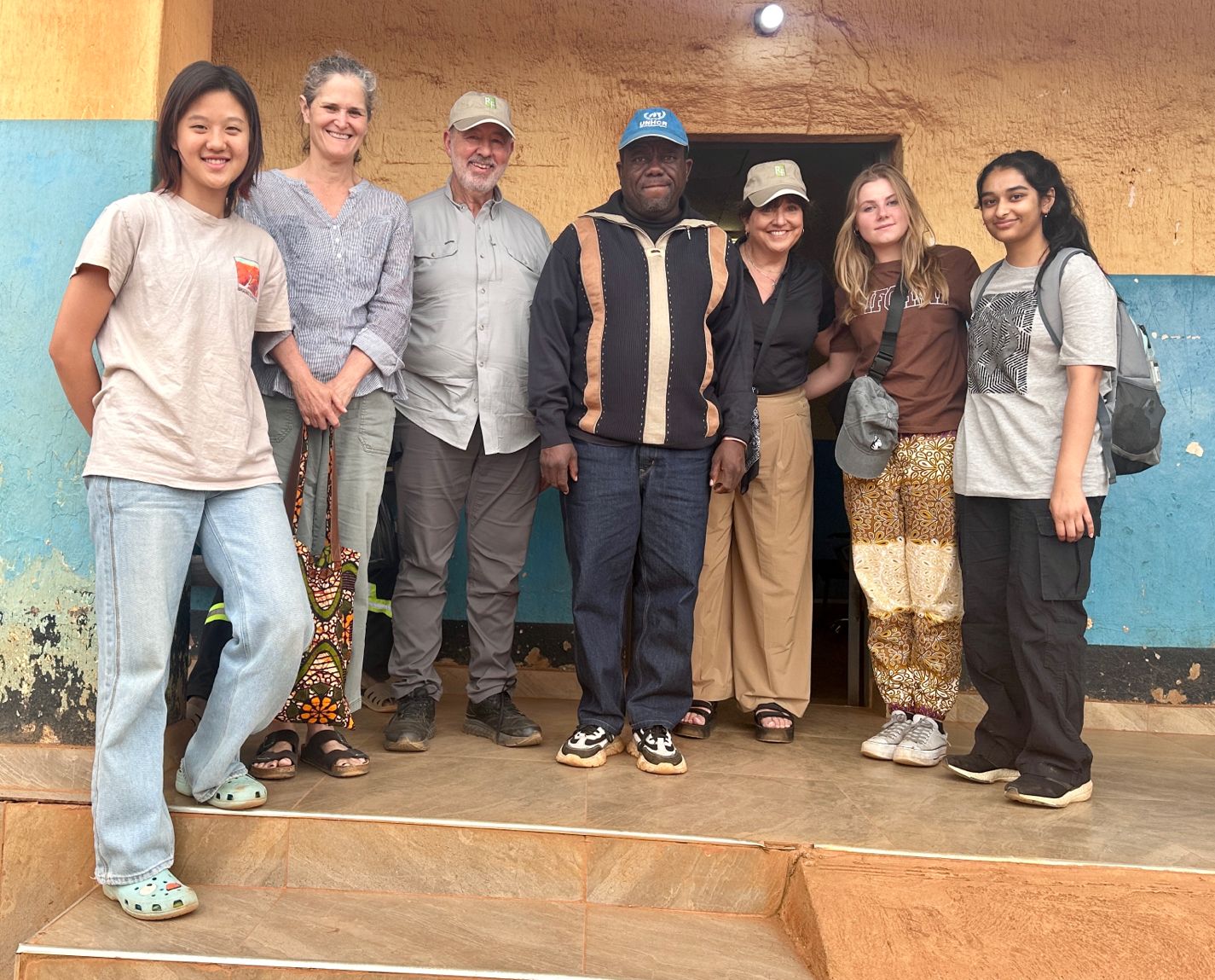 Sharon Crane, R. Danny Huntington, and others standing outside a building in Malawi