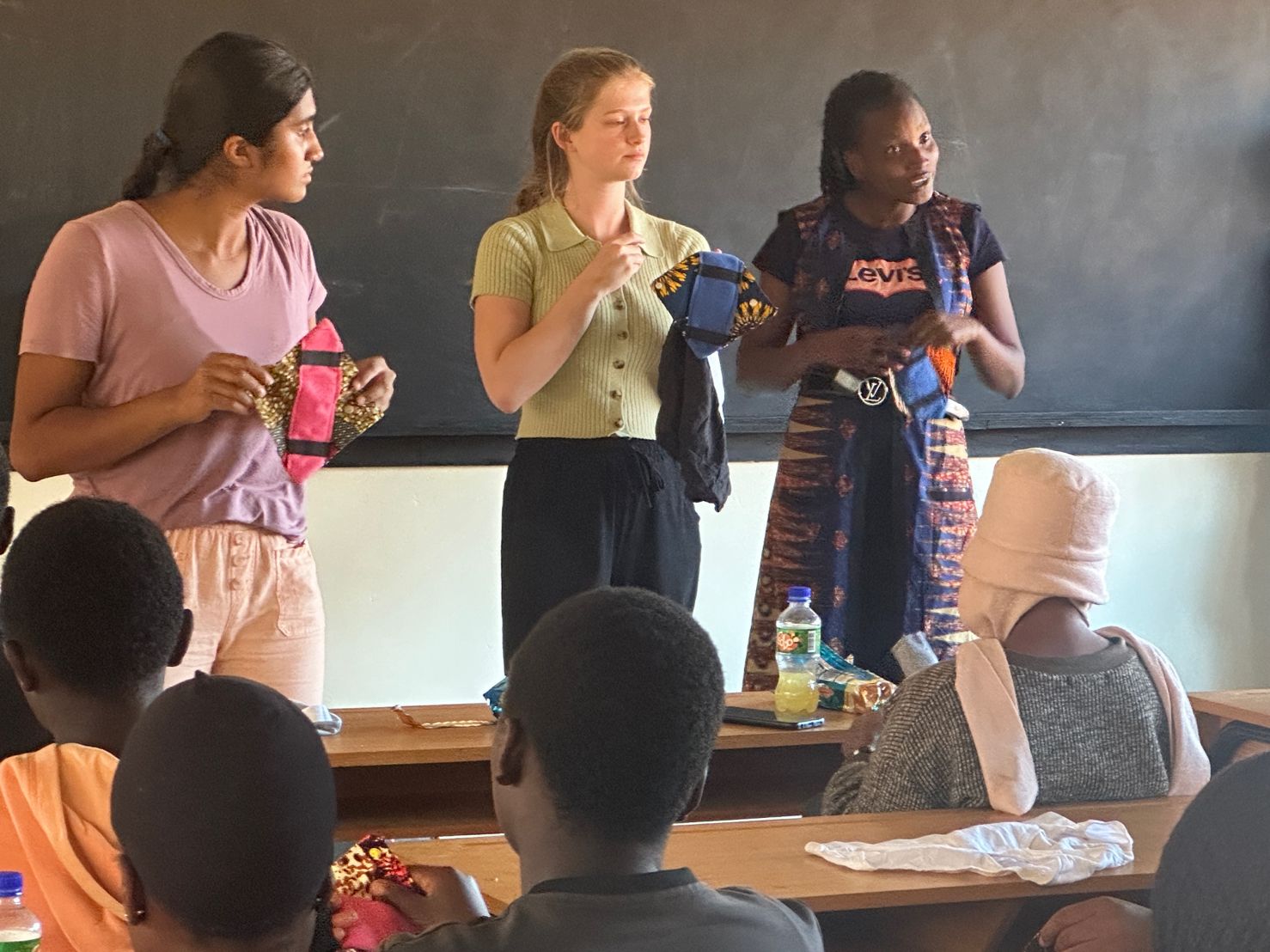 Pennington School students and representatives from Malawi discussing the menstrual product with students